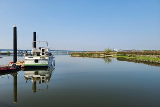 A yacht anchored by a beautiful river